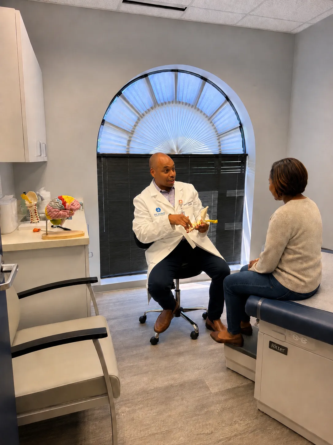 Dr Shannon consulting with patient in office